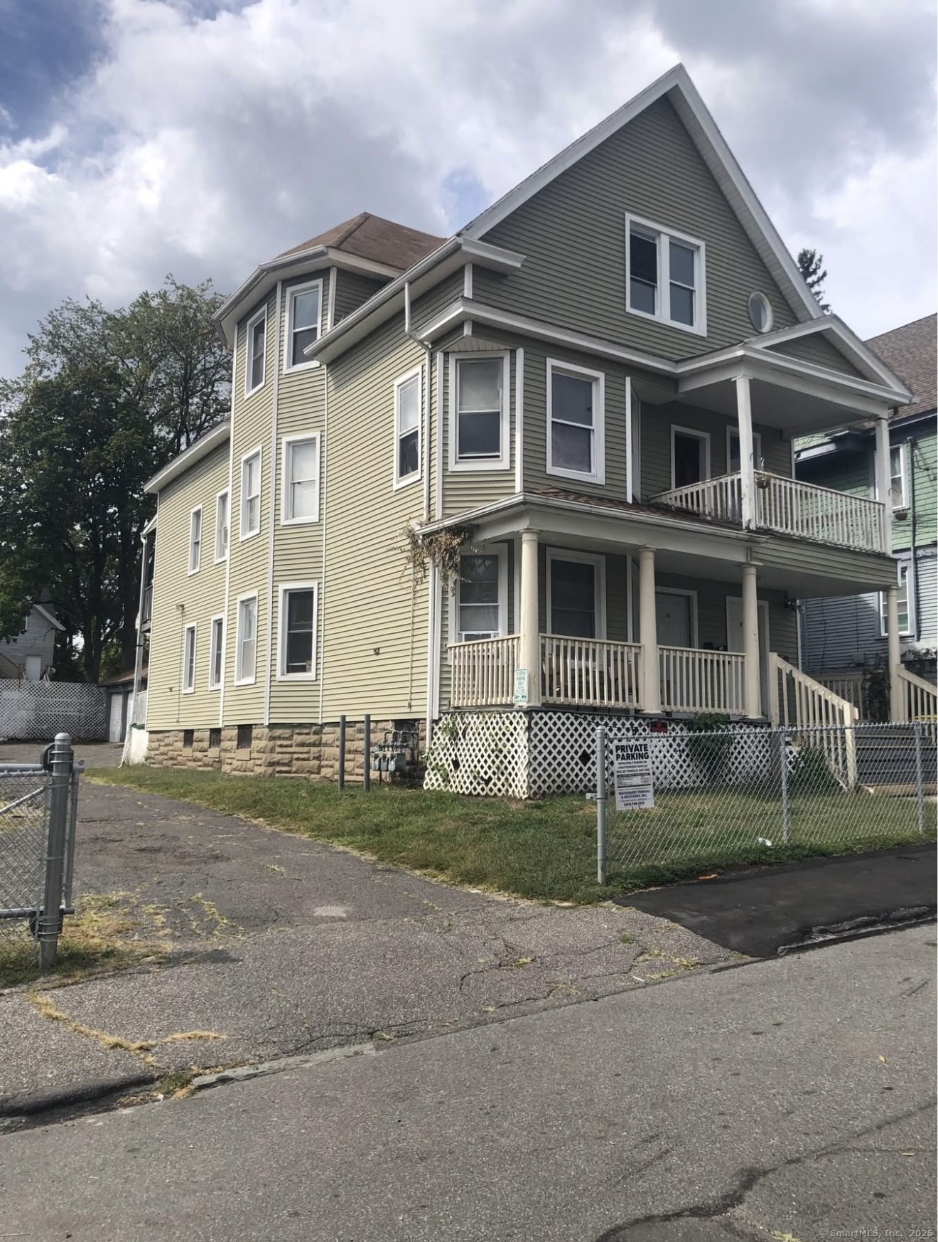 167 Chestnut Avenue, Unit 3 Waterbury, CT 06710 - Photo 2 of 10 front view of a house with a yard