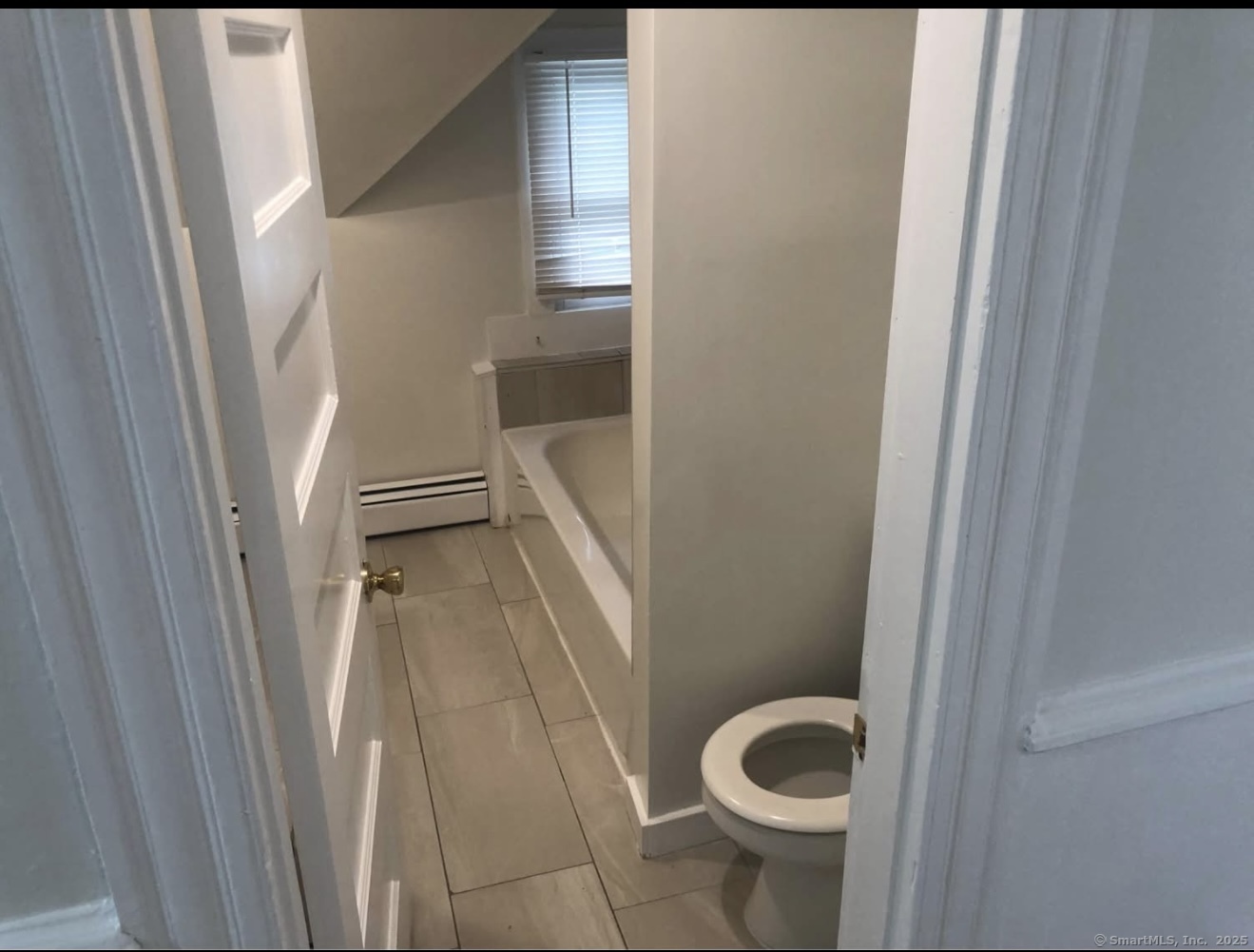 167 Chestnut Avenue, Unit 3 Waterbury, CT 06710 - Photo 5 of 10 a bathroom with a sink and toilet