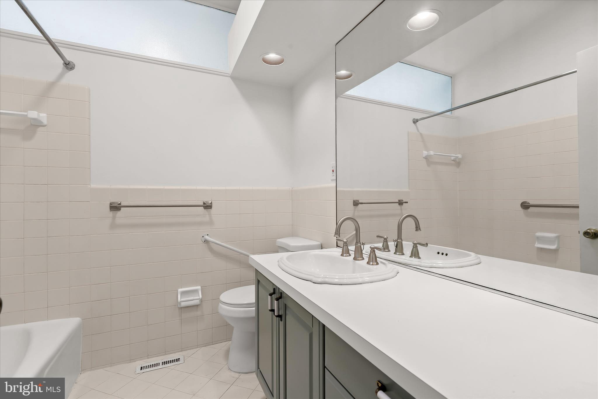 7449 Prince George Road Pikesville, MD 21208 - Photo 22 of 37 Hall bathroom