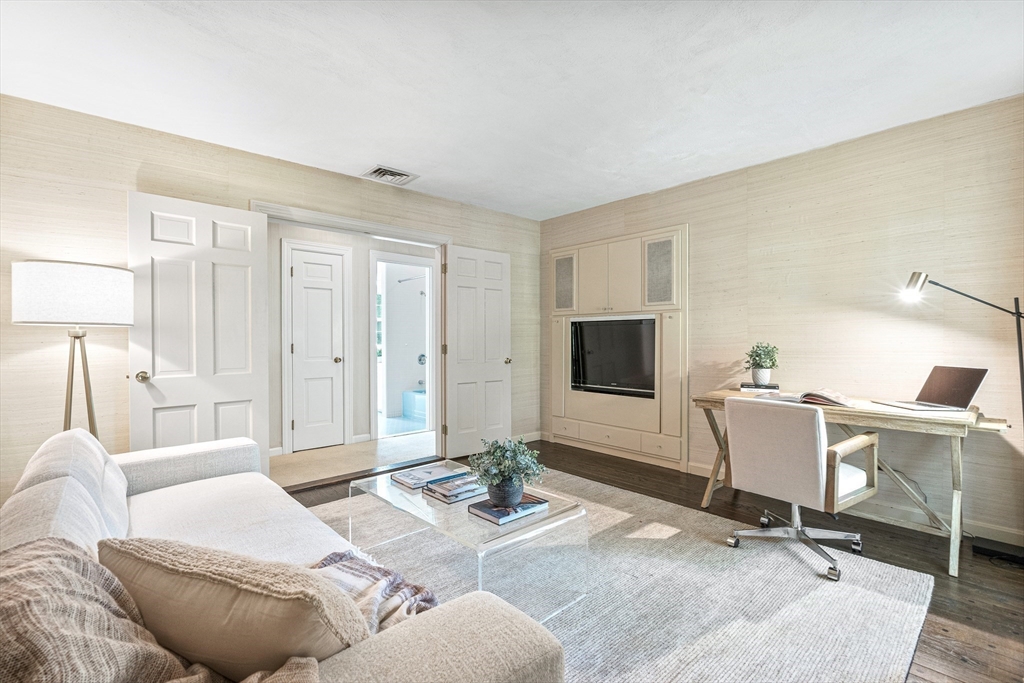 5 Deer Path Lane Weston, MA 02493 - Photo 13 of 26 a living room with furniture and a flat screen tv