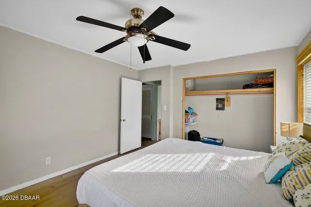 a bedroom with bed and a window