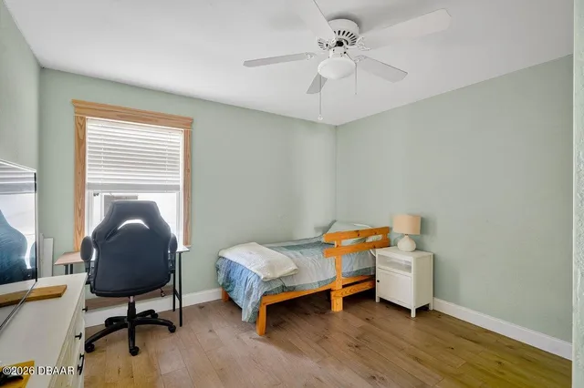 a bedroom with furniture and windows