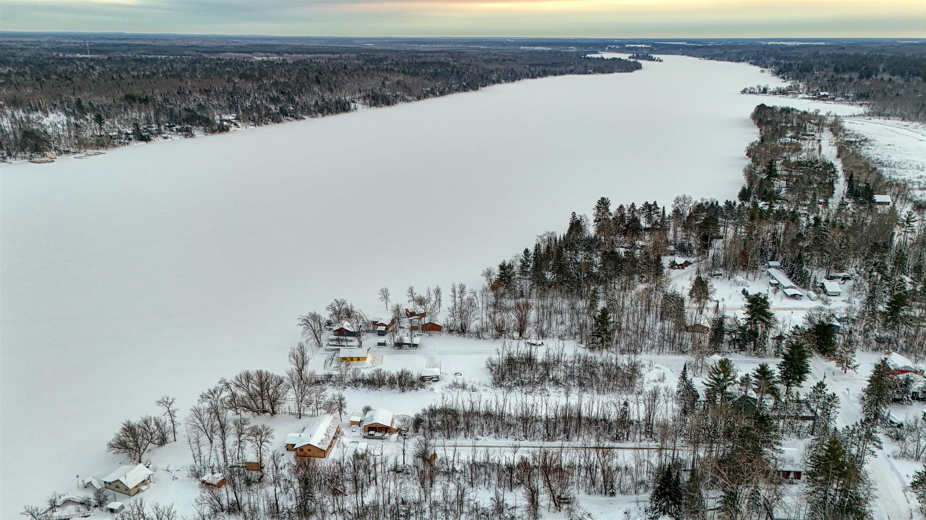 10922 South Stone Road Solon Springs, WI 54873 - Photo 14 of 64 Snowy aerial view with a view of trees