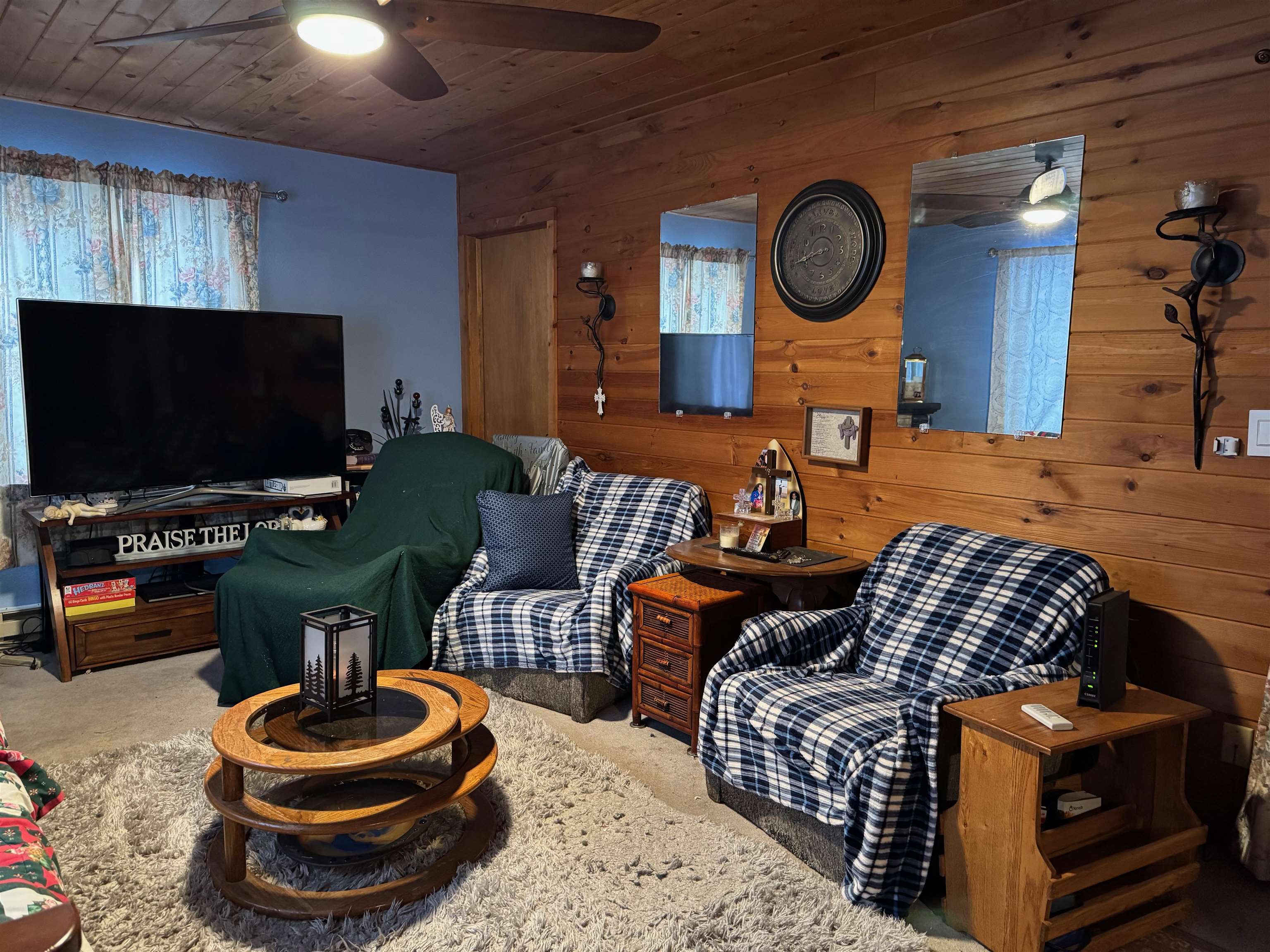 10922 South Stone Road Solon Springs, WI 54873 - Photo 22 of 64 Living area featuring wood walls, wood ceiling, and a ceiling fan