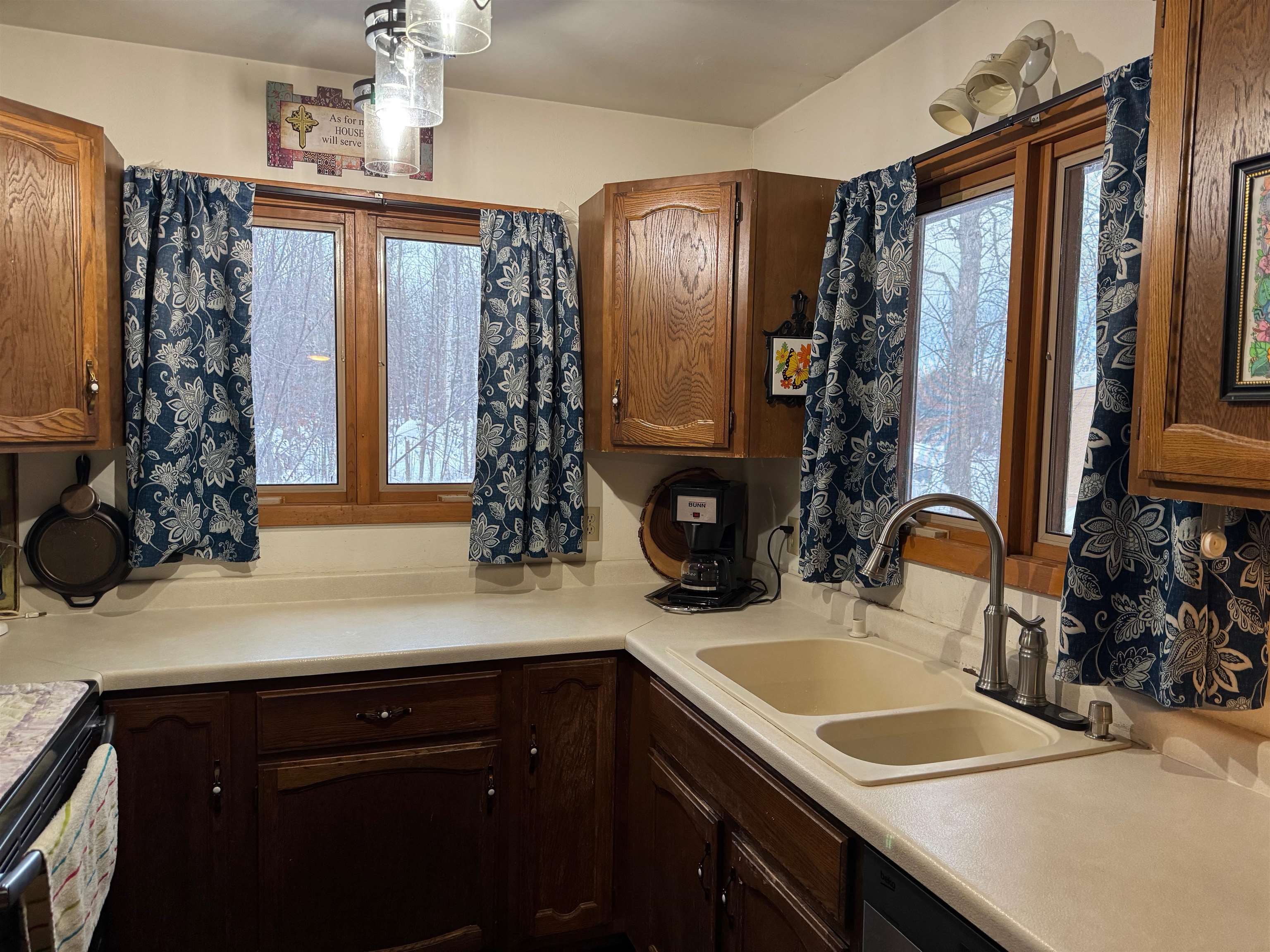 10922 South Stone Road Solon Springs, WI 54873 - Photo 26 of 64 Kitchen with healthy amount of natural light, light countertops, and decorative light fixtures