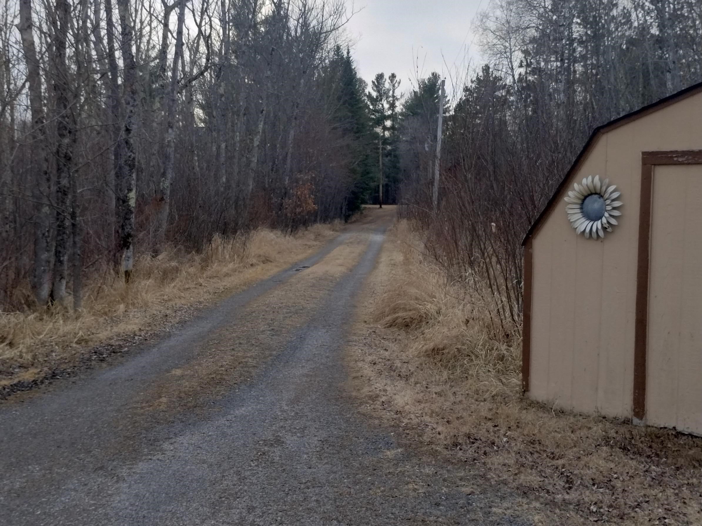 10922 South Stone Road Solon Springs, WI 54873 - Photo 47 of 64 View of street featuring a wooded view
