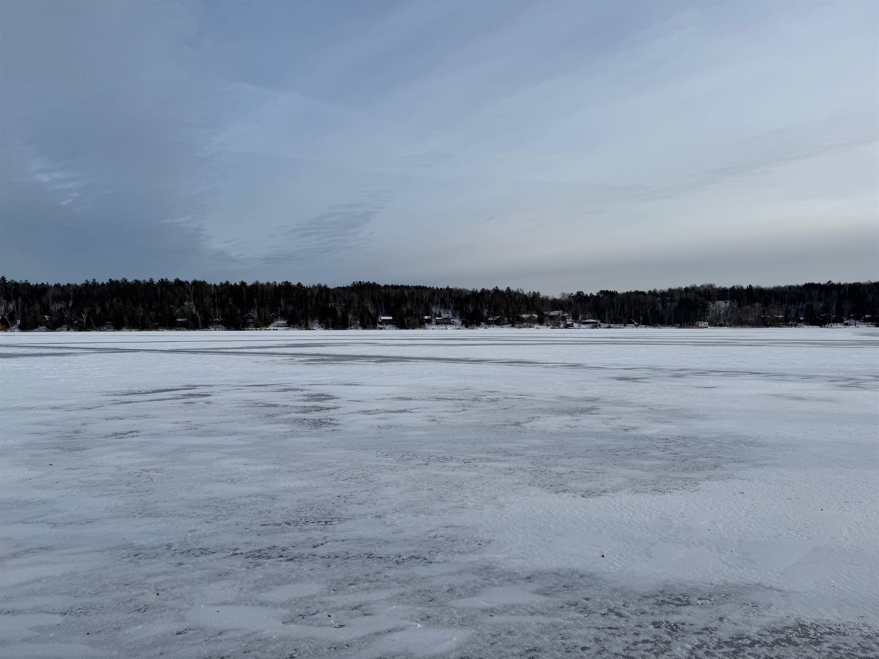 10922 South Stone Road Solon Springs, WI 54873 - Photo 63 of 64 Yard layered in snow featuring a forest view