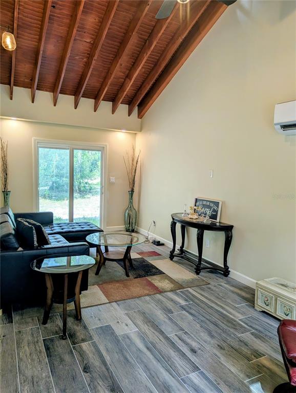 18001 Nelson Road Spring Hill, FL 34610 - Photo 13 of 29 a living room with furniture and a wooden floor