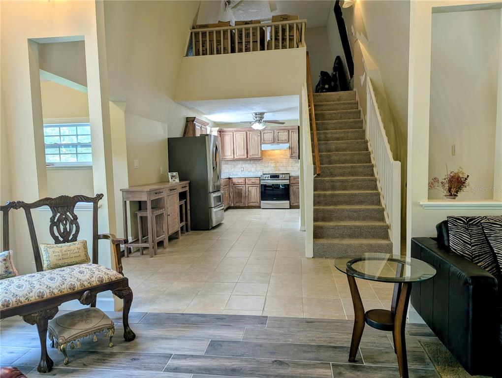 18001 Nelson Road Spring Hill, FL 34610 - Photo 15 of 29 a living room with furniture and a flat screen tv