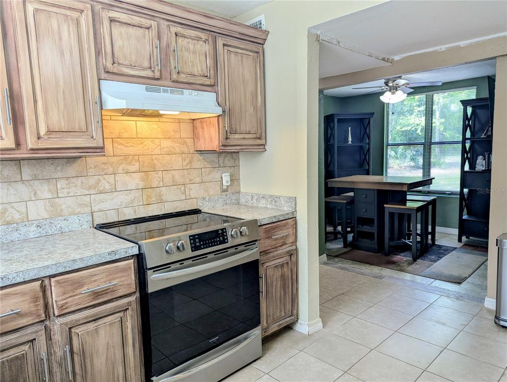 18001 Nelson Road Spring Hill, FL 34610 - Photo 18 of 29 a kitchen with a stove and a sink