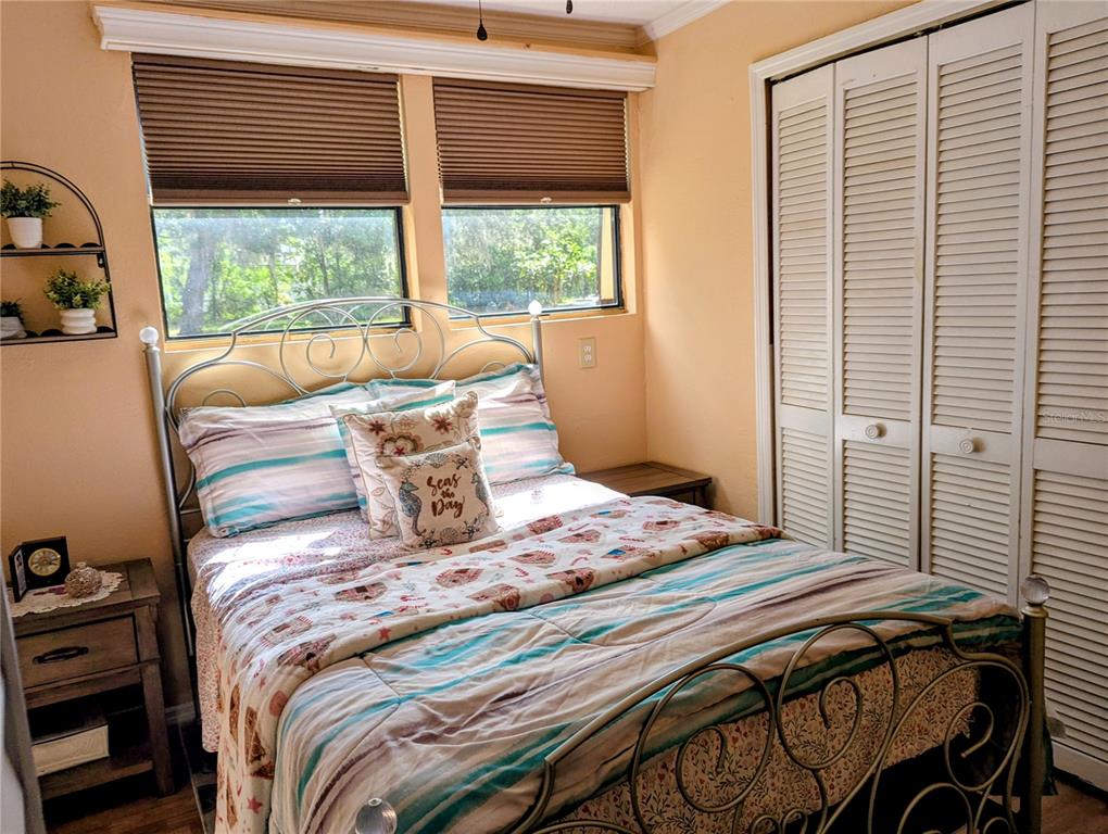 18001 Nelson Road Spring Hill, FL 34610 - Photo 23 of 29 a bedroom with a bed and a window