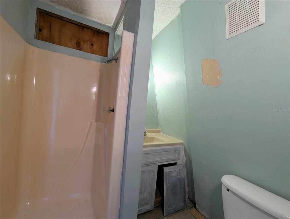 18001 Nelson Road Spring Hill, FL 34610 - Photo 29 of 29 a bathroom with a granite countertop sink and a toilet