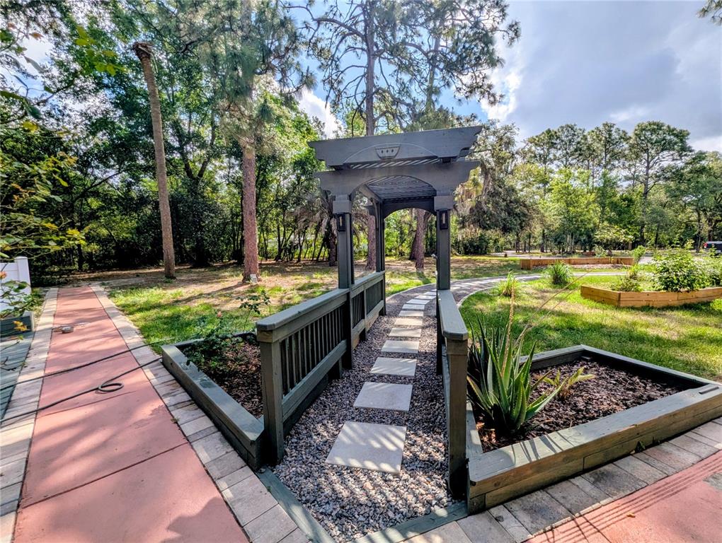 18001 Nelson Road Spring Hill, FL 34610 - Photo 3 of 29 a view of a backyard with small tub