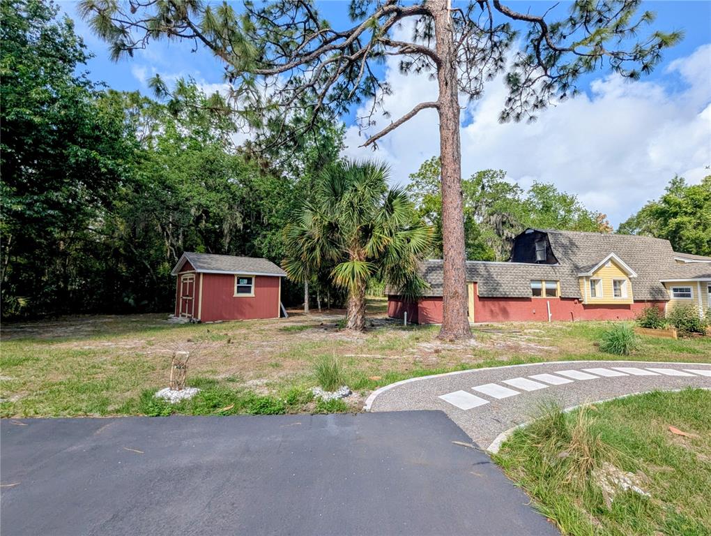 18001 Nelson Road Spring Hill, FL 34610 - Photo 4 of 29 a front view of a house with a yard and garage