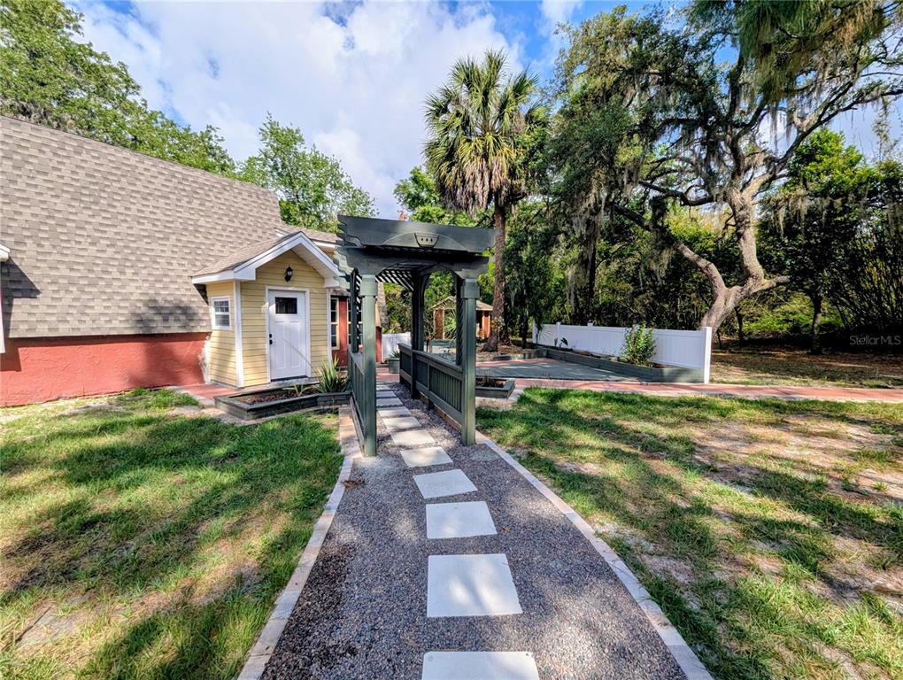 18001 Nelson Road Spring Hill, FL 34610 - Photo 5 of 29 a front view of a house with garden