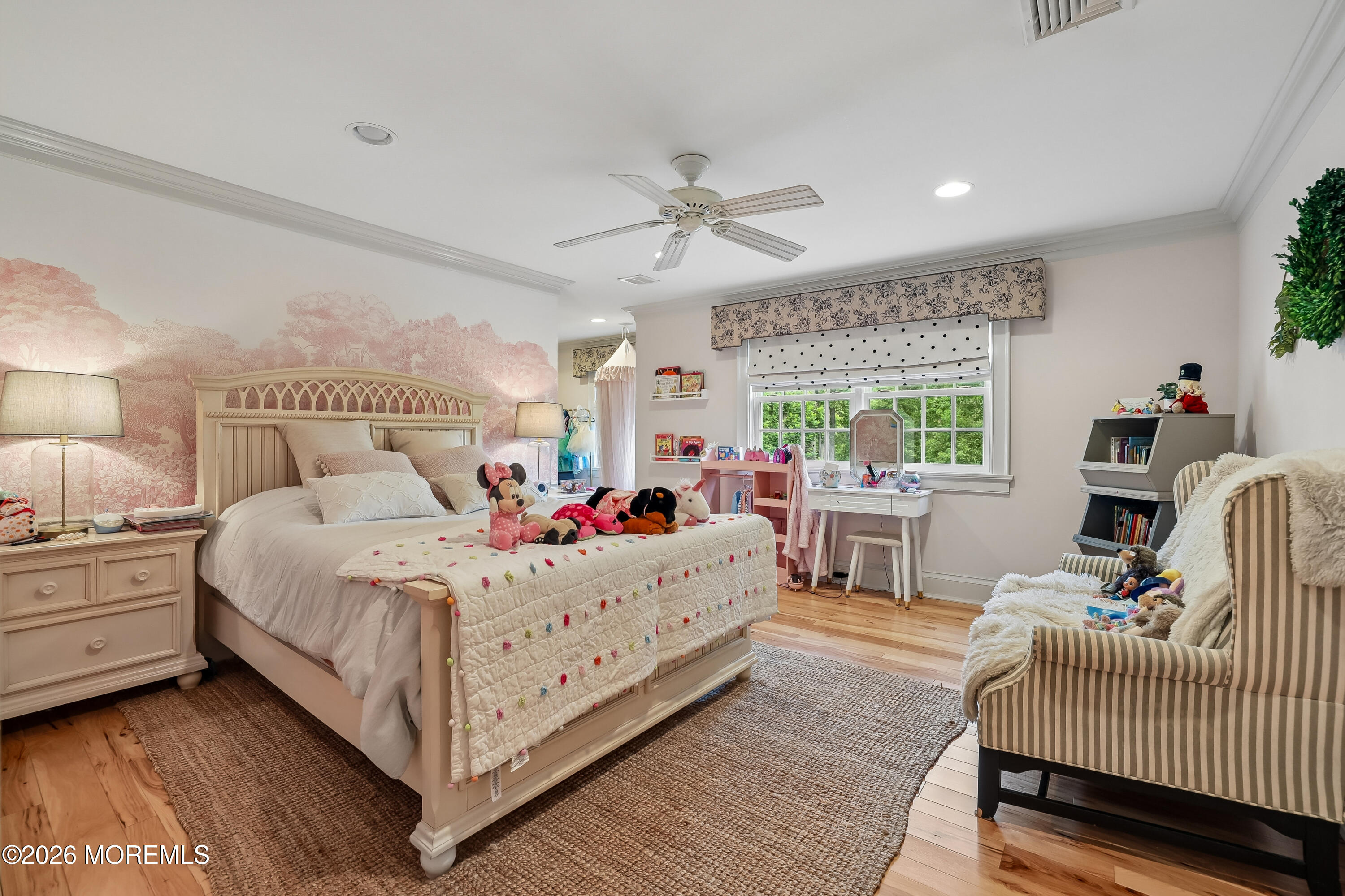 92 Tulip Lane Colts Neck, NJ 07722 - Photo 27 of 55 a bedroom with a bed and a chandelier