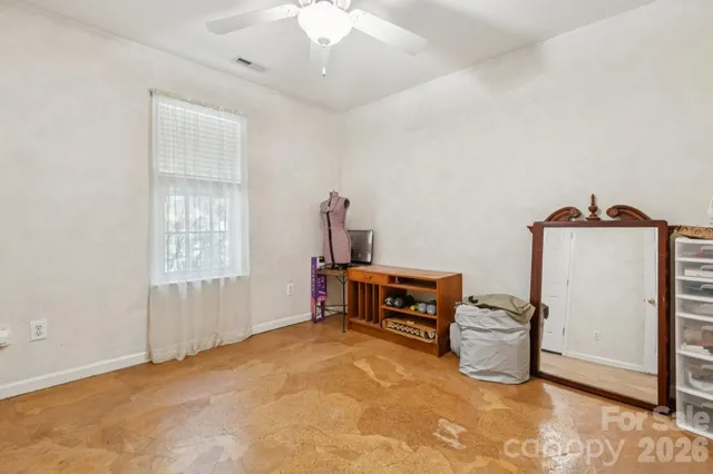 a view of a chair and table in the balcony