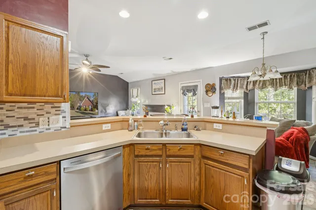 a kitchen with a sink and cabinets