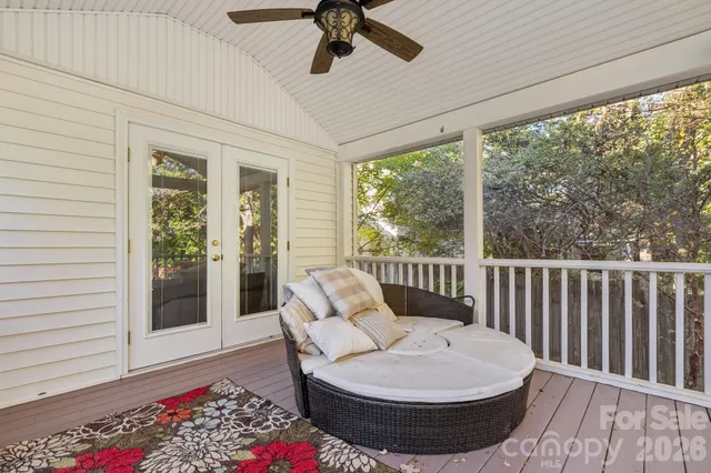 a view of bedroom with a bed and wooden floor