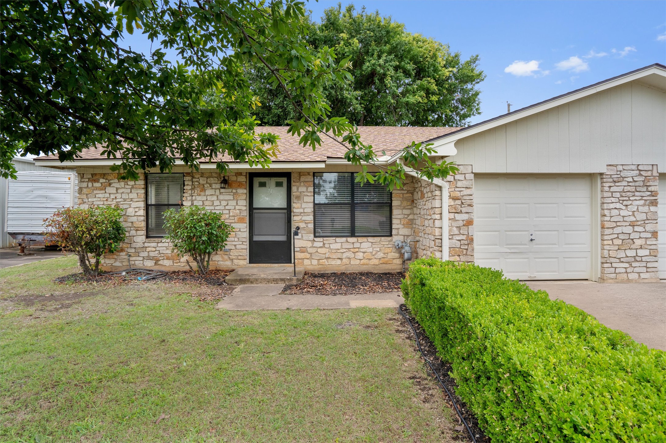 2805 Davis Street, Unit A Taylor, TX 76574 - Photo 1 of 12 a front view of a house with garden
