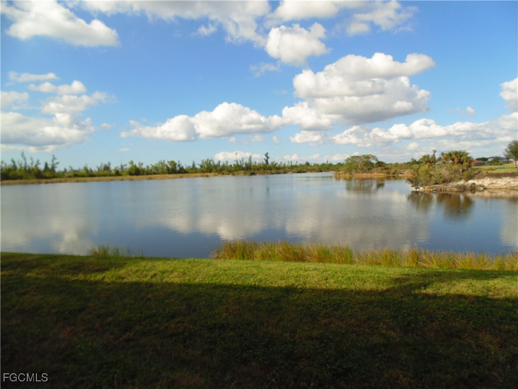 2615 Somerville Loop, Unit 303 Cape Coral, FL 33991 - Photo 1 of 40 a view of a lake