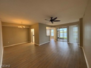2615 Somerville Loop, Unit 303 Cape Coral, FL 33991 - Photo 13 of 40 a view of an empty room with a window and wooden floor