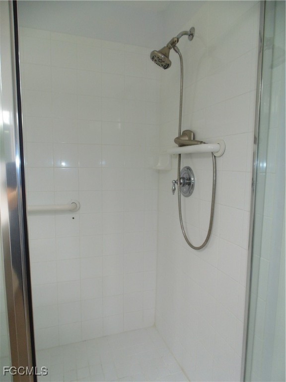 2615 Somerville Loop, Unit 303 Cape Coral, FL 33991 - Photo 20 of 40 a bathroom with a shower