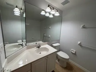 an empty room with wooden floor and closet