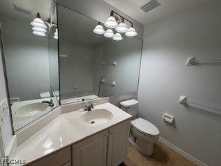 2615 Somerville Loop, Unit 303 Cape Coral, FL 33991 - Photo 26 of 40 a bathroom with a sink a toilet and a mirror