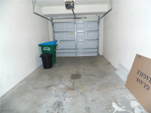 a view of a house with a garden and signage