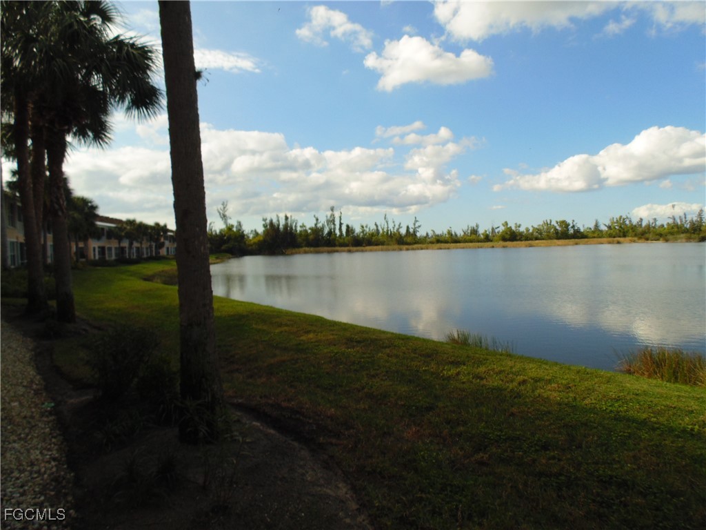 2615 Somerville Loop, Unit 303 Cape Coral, FL 33991 - Photo 39 of 40 a view of a lake from a yard