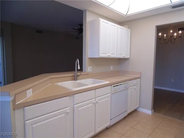 a kitchen with a sink and cabinets