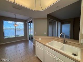 2615 Somerville Loop, Unit 303 Cape Coral, FL 33991 - Photo 6 of 40 a bathroom with a sink and a bathtub