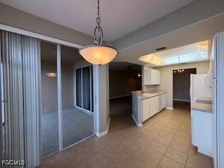 2615 Somerville Loop, Unit 303 Cape Coral, FL 33991 - Photo 8 of 40 a kitchen with stainless steel appliances granite countertop a refrigerator and a sink