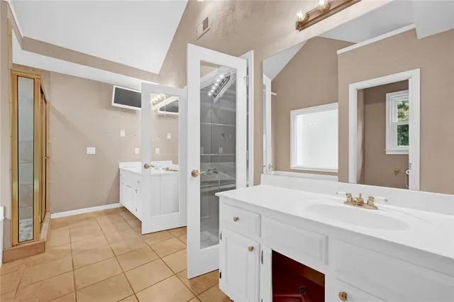 a bathroom with a bathtub and shower