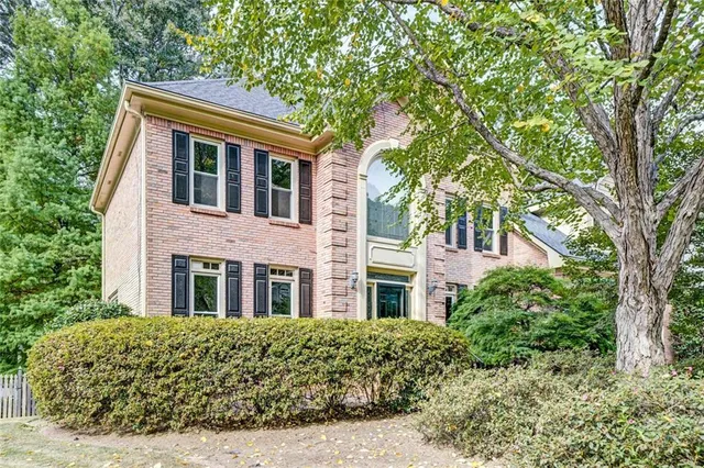 front view of house with a tree