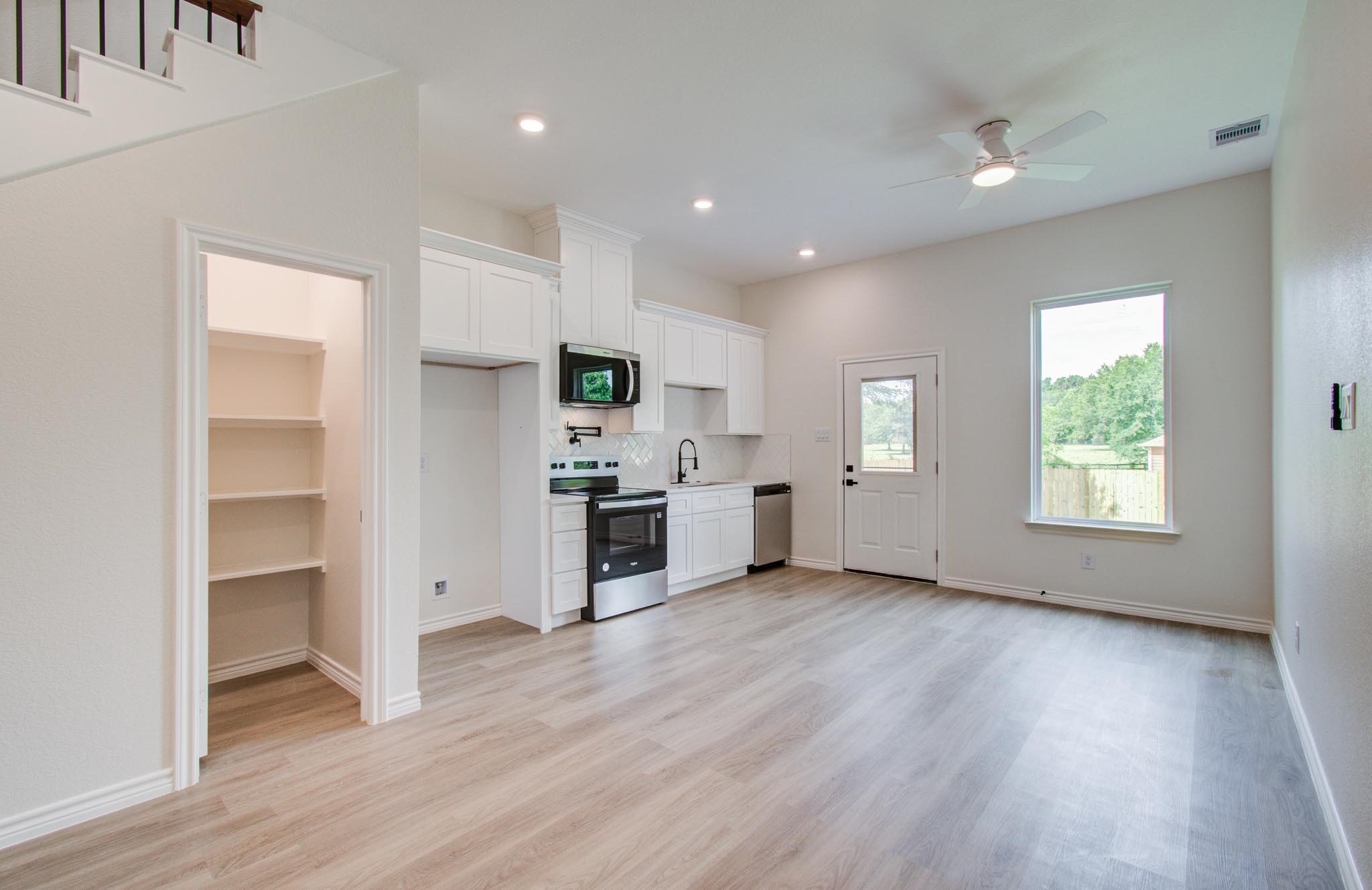 15301 Coaltown Road Willis, TX 77378 - Photo 16 of 38 a view of kitchen with wooden floor and electronic appliances