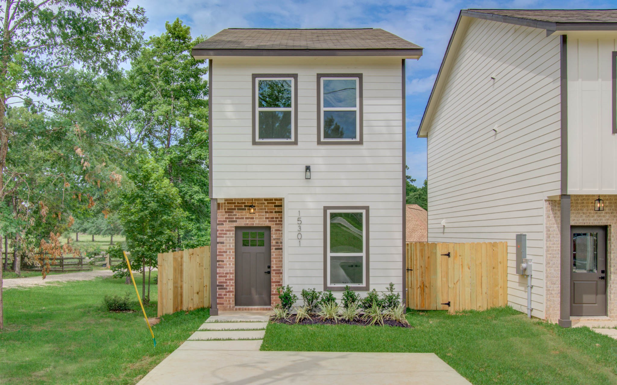 15301 Coaltown Road Willis, TX 77378 - Photo 3 of 38 a front view of a house with a yard and an outdoor seating