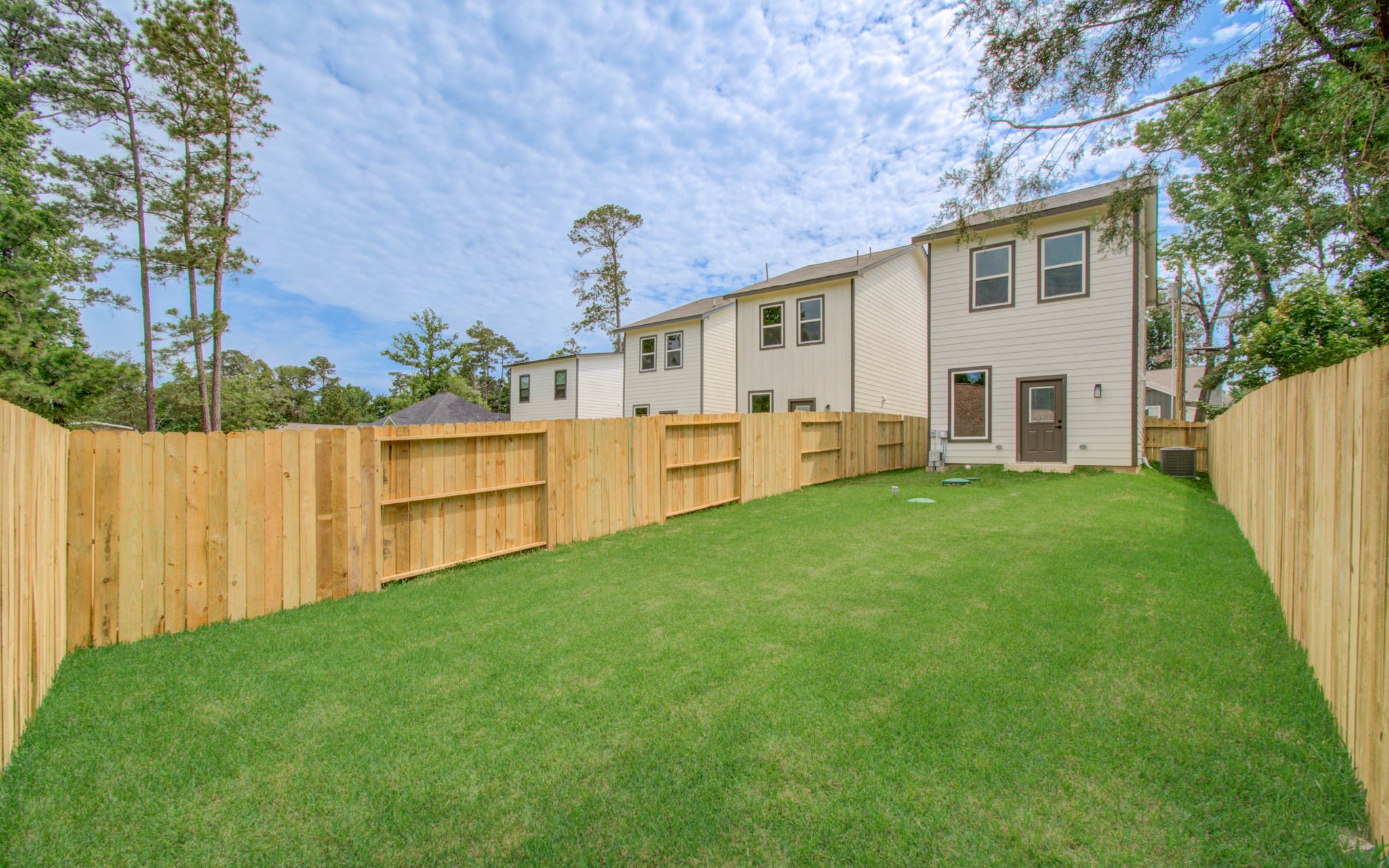 15301 Coaltown Road Willis, TX 77378 - Photo 36 of 38 a view of a house with a yard and sitting area