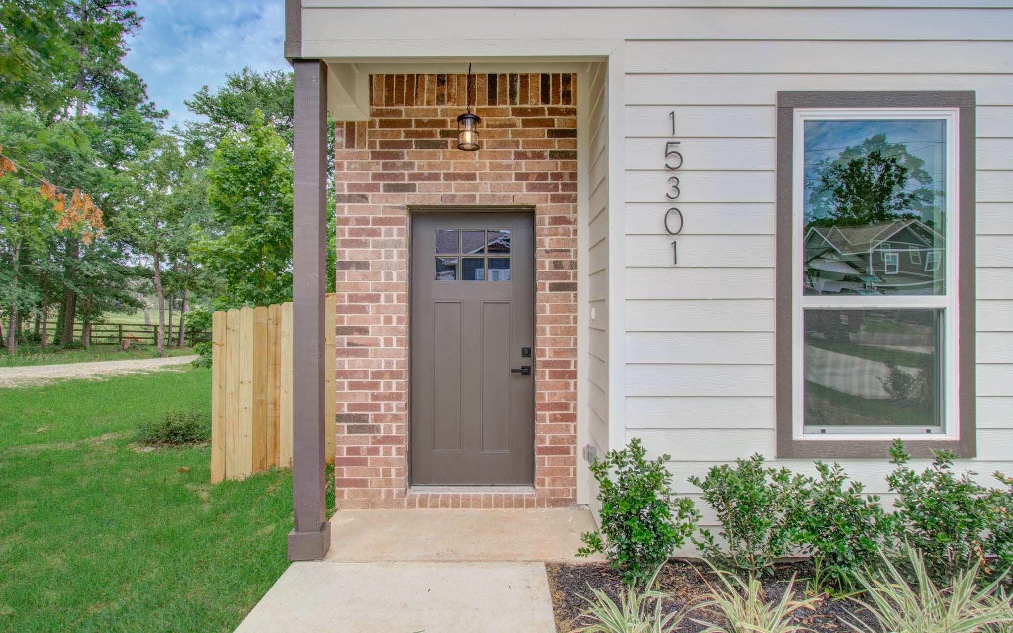 15301 Coaltown Road Willis, TX 77378 - Photo 4 of 38 a front view of a house with a yard