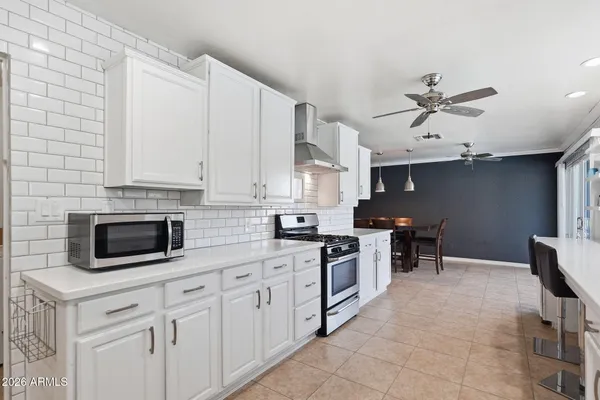 a kitchen with a sink cabinets and window