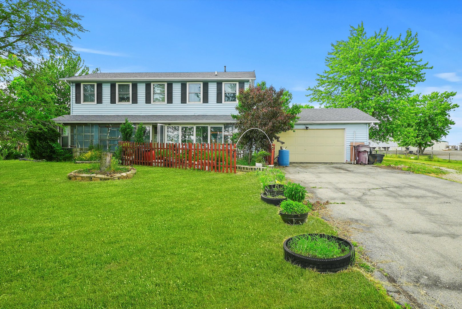 a front view of a house with garden