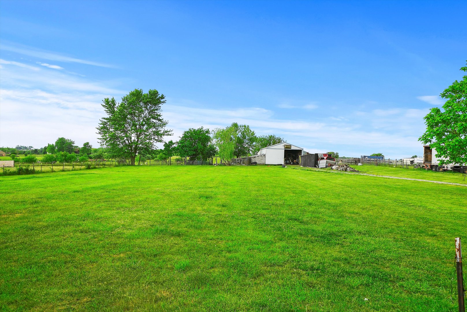 4224 West Offner Road Monee, IL 60449 - Photo 13 of 32 a green field with lots of trees in the background
