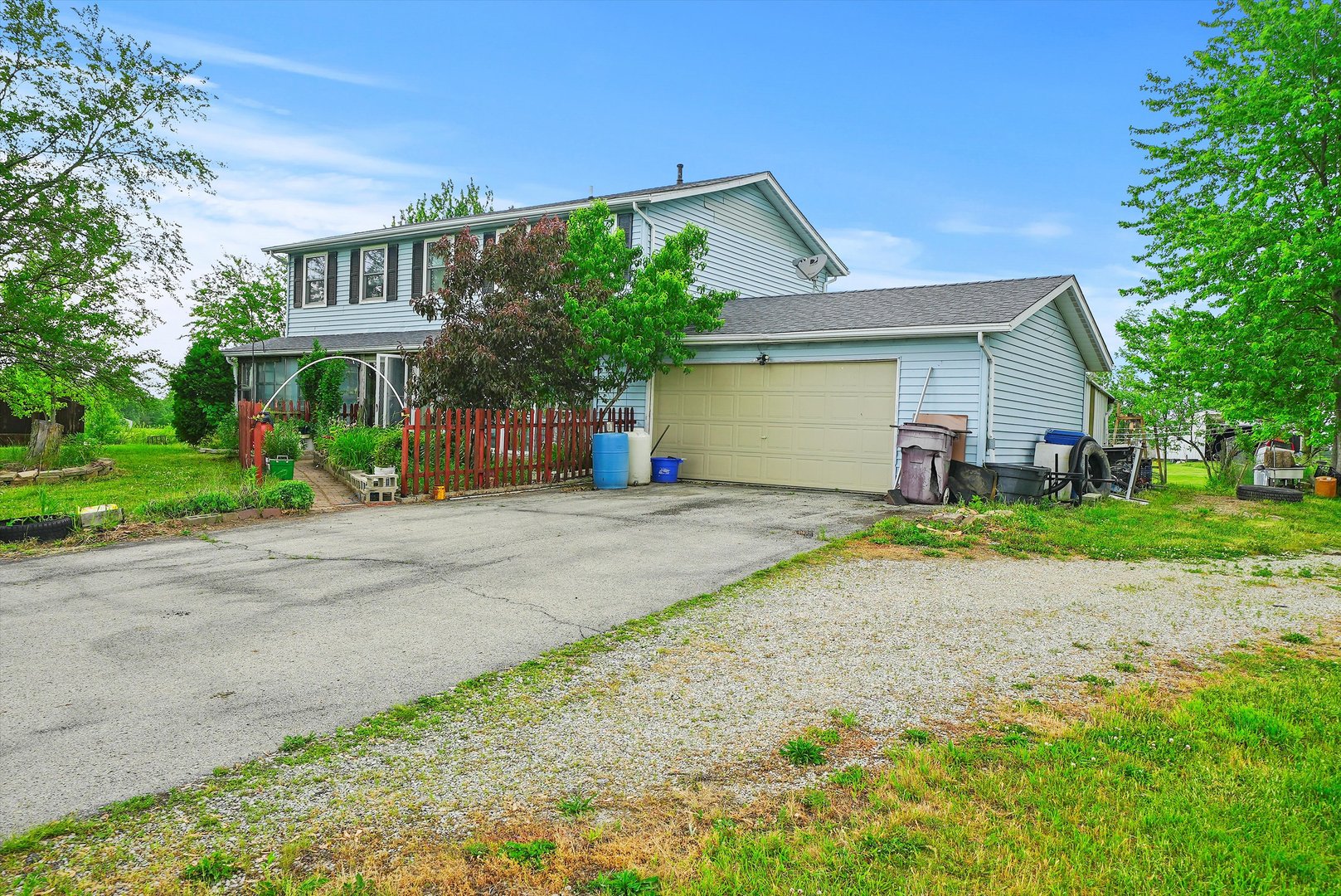 4224 West Offner Road Monee, IL 60449 - Photo 28 of 32 a front view of a house with a yard and a garage