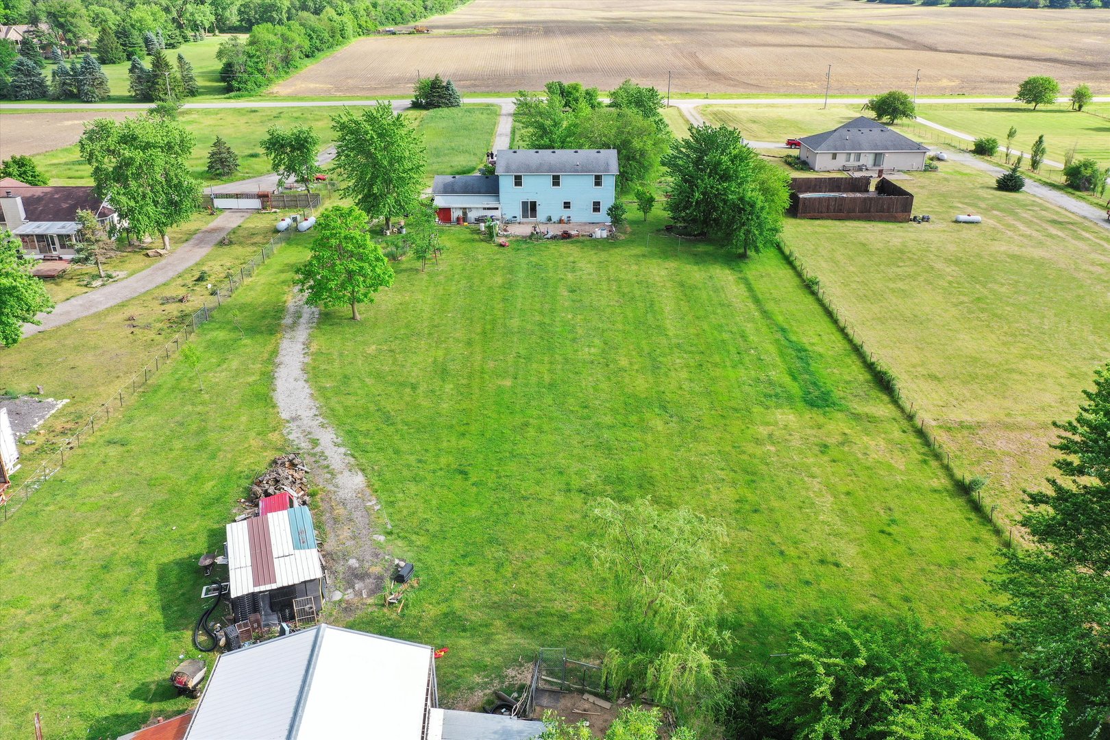 4224 West Offner Road Monee, IL 60449 - Photo 8 of 32 a aerial view of a house with a yard and lake view
