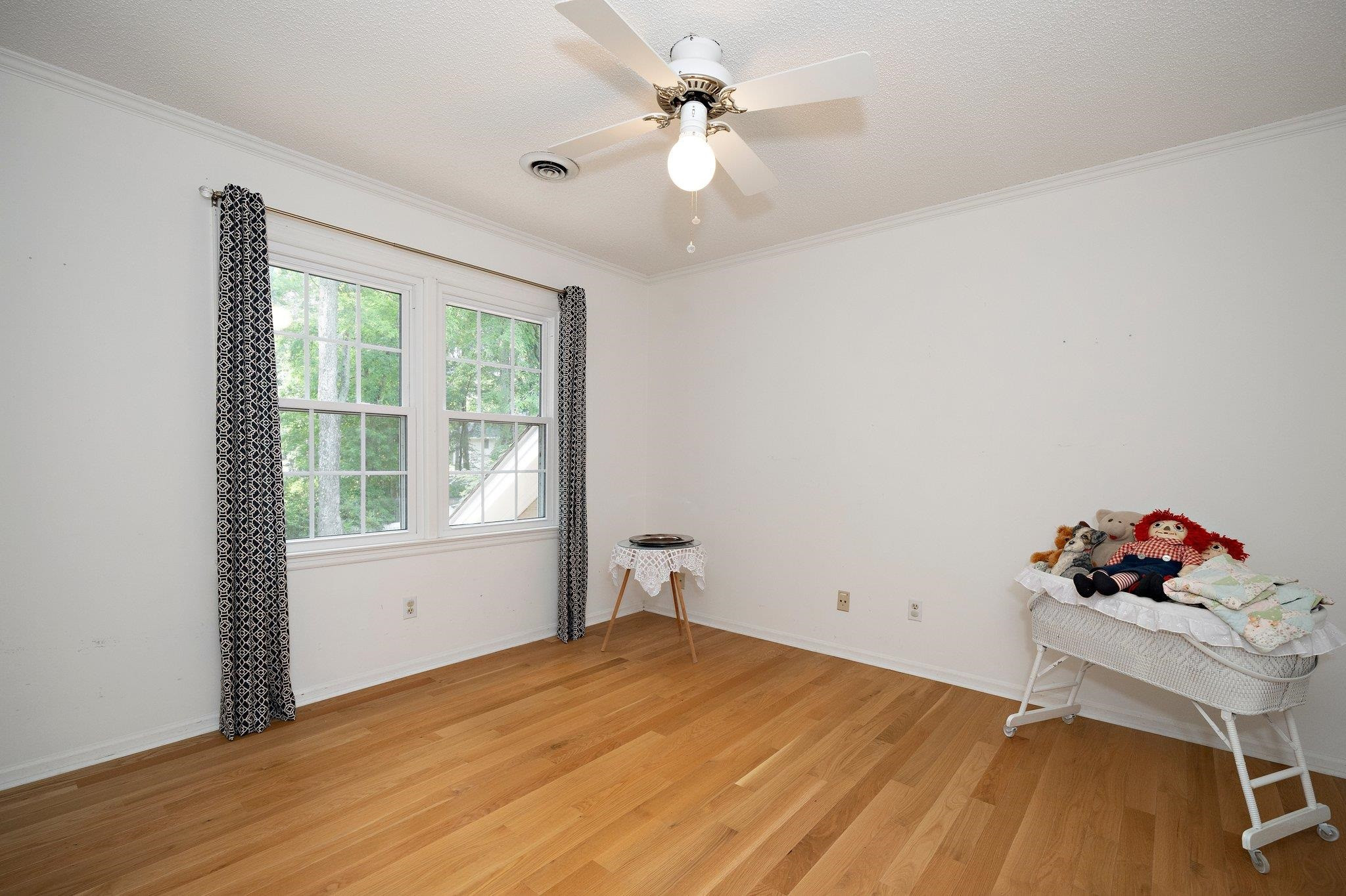 1512 Pony Run Road Raleigh, NC 27615 - Photo 26 of 39 Secondary 2nd Floor Bedroom has Solid Hardwood Floors and Ceiling Fan Secondary Bedroom