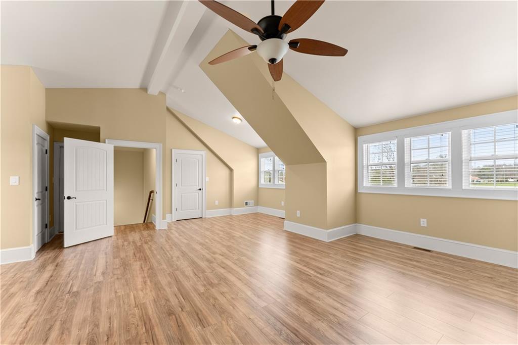 725 County Farm Road Jefferson, GA 30549 - Photo 38 of 66 a view of an empty room with window and wooden floor
