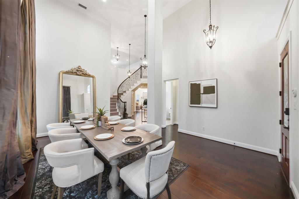 624 Sorrell Road McKinney, TX 75072 - Photo 5 of 28 a view of a dining room with furniture and wooden floor