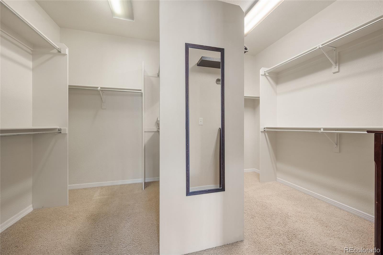 22426 East Roxbury Place Aurora, CO 80016 - Photo 32 of 50 a view of walk in closet with empty racks