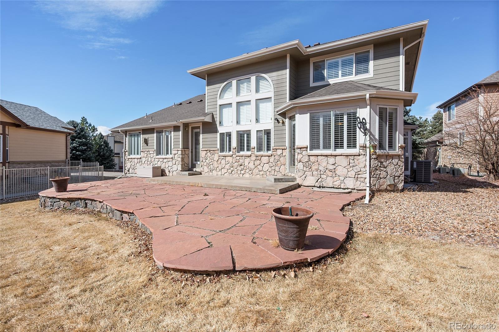 22426 East Roxbury Place Aurora, CO 80016 - Photo 45 of 50 a view of a house with a yard